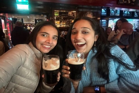Two students drinking guinness
