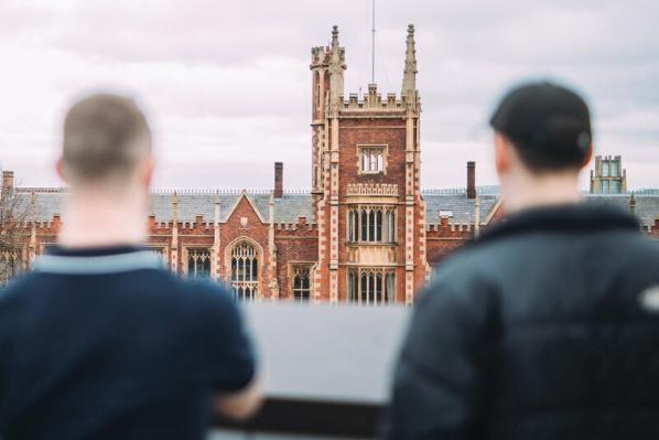 Two students facing the front of the Lanyon Building
