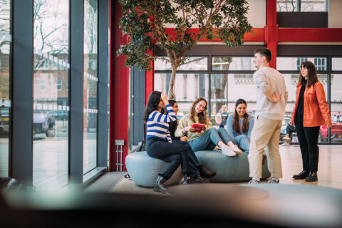 Group of students talking in One Elmwood student centre