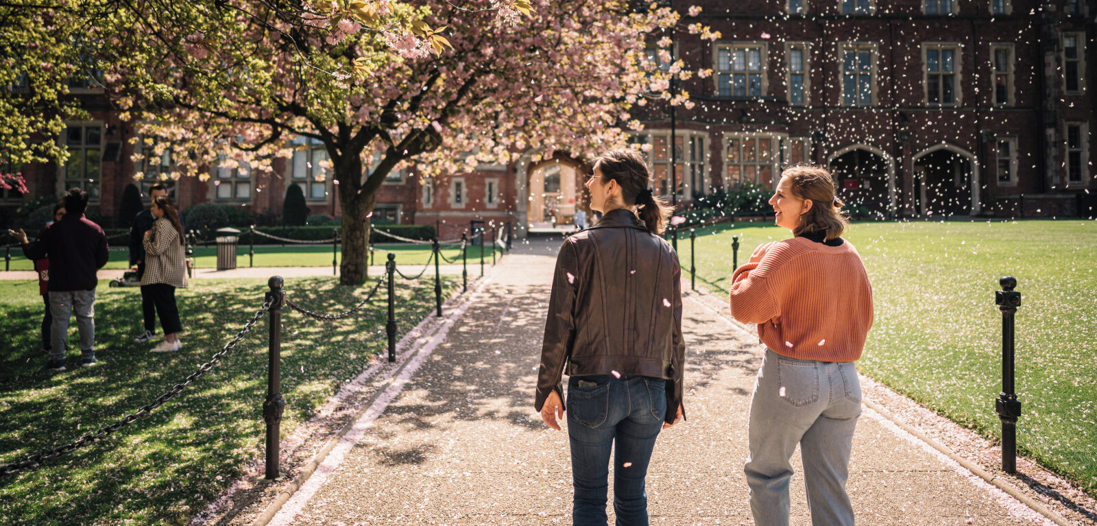 Two students walking through the Quad