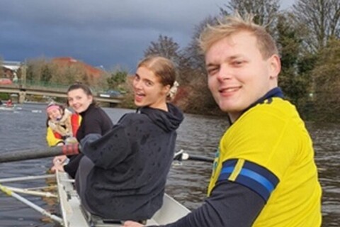 Students from rowing club in boat