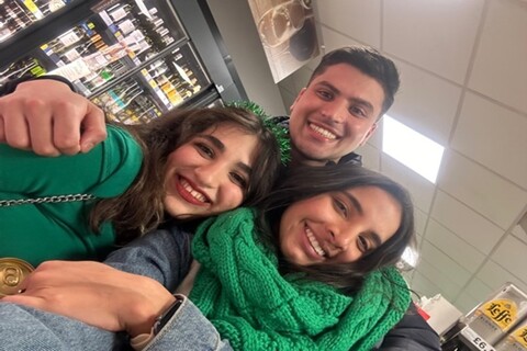 Three students celebrating St Patrick's Day