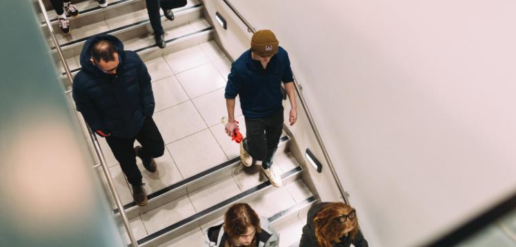 Group of students walking downstairs