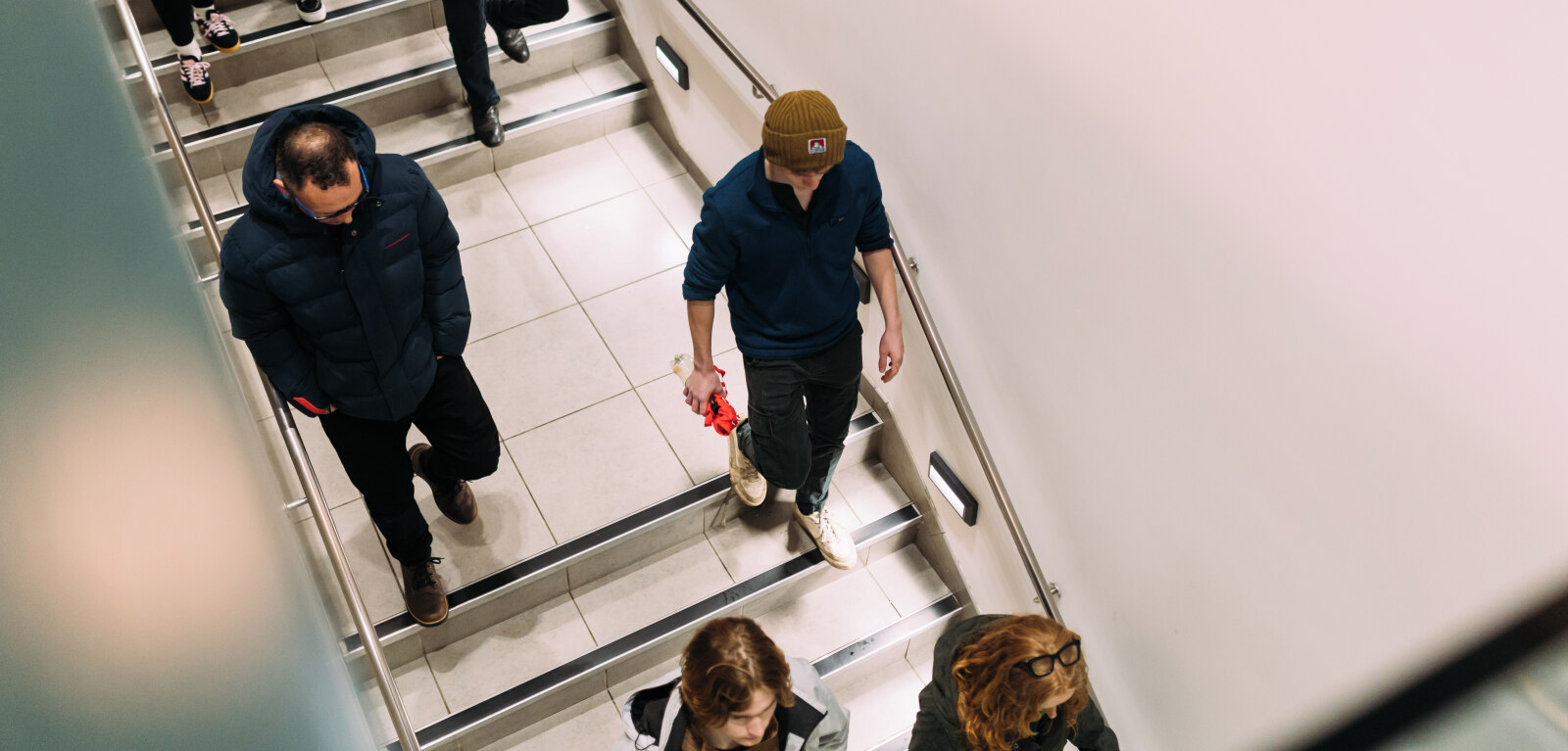Group of students walking downstairs