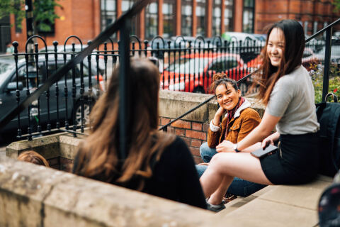 Students sitting on steps in University Square