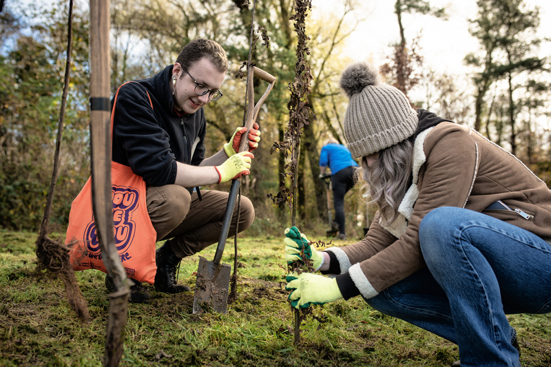 Students volunteering outdoors