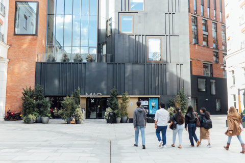 Group of students walking towards The Mac