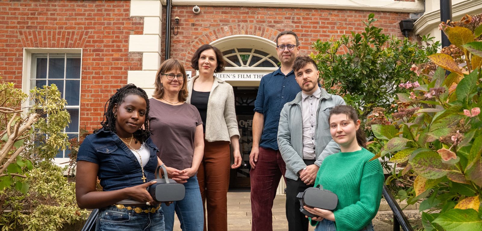 Group of people standing on the steps of Queen's Film Theatre