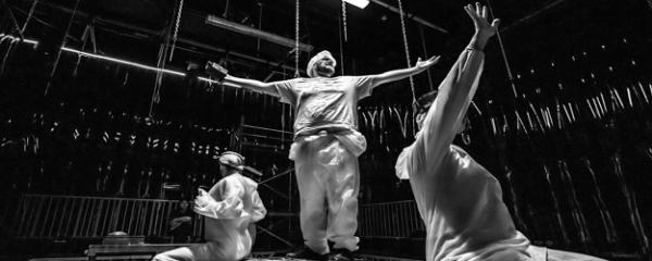 Three actors in theatre setting