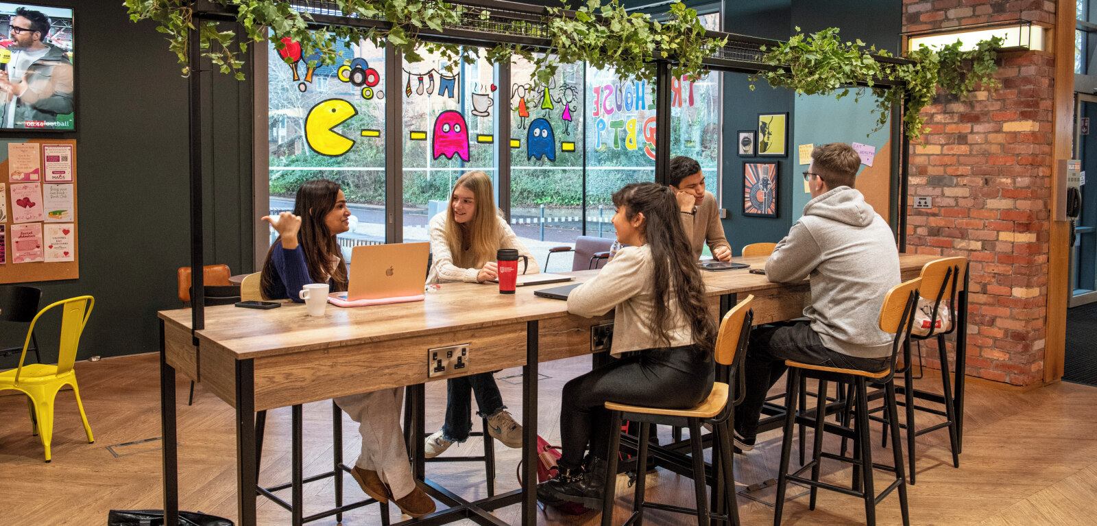 Group of students sitting at table in the Treehouse