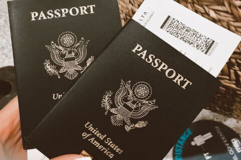 Person holding two American passports