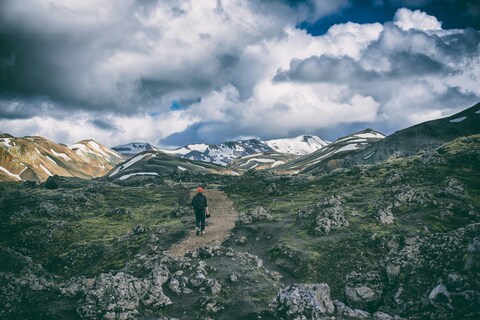 Woman hiking up a mountain