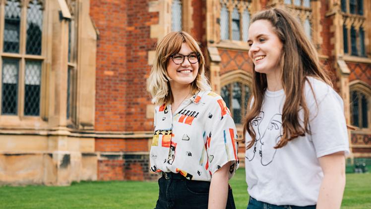 Two student walk in the quad