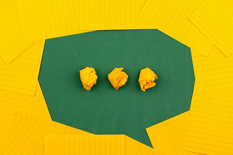 yellow and green speech bubble made of paper