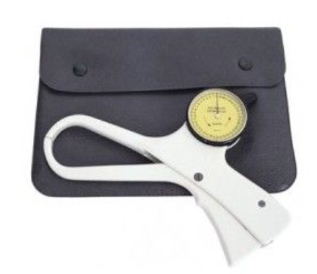 A picture of the skinfold calipers sitting on their black, leather slip bag.