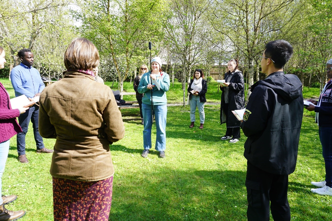 People gathered in a green area