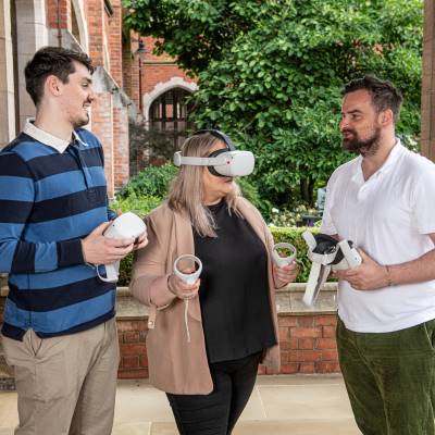 3 students one with VR