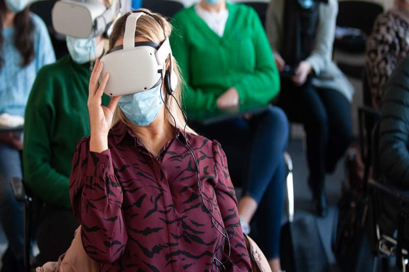 seated students wearing VR technology