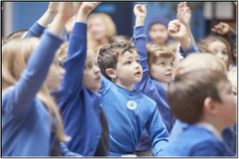 group of young children arms raised