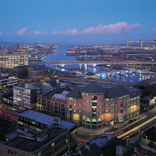 night time view over Belfast with harland and wolff cranes in the background