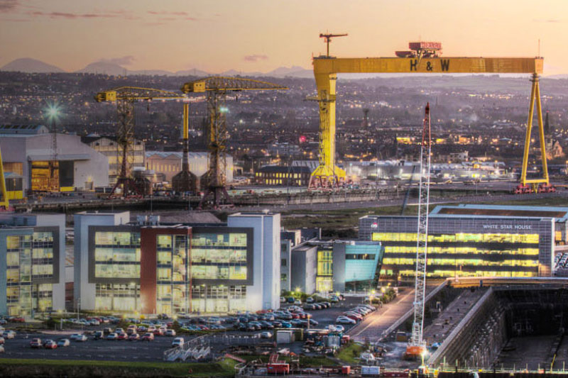 Iconic image of the institute next to Harland and Wolff cranes in Belfast