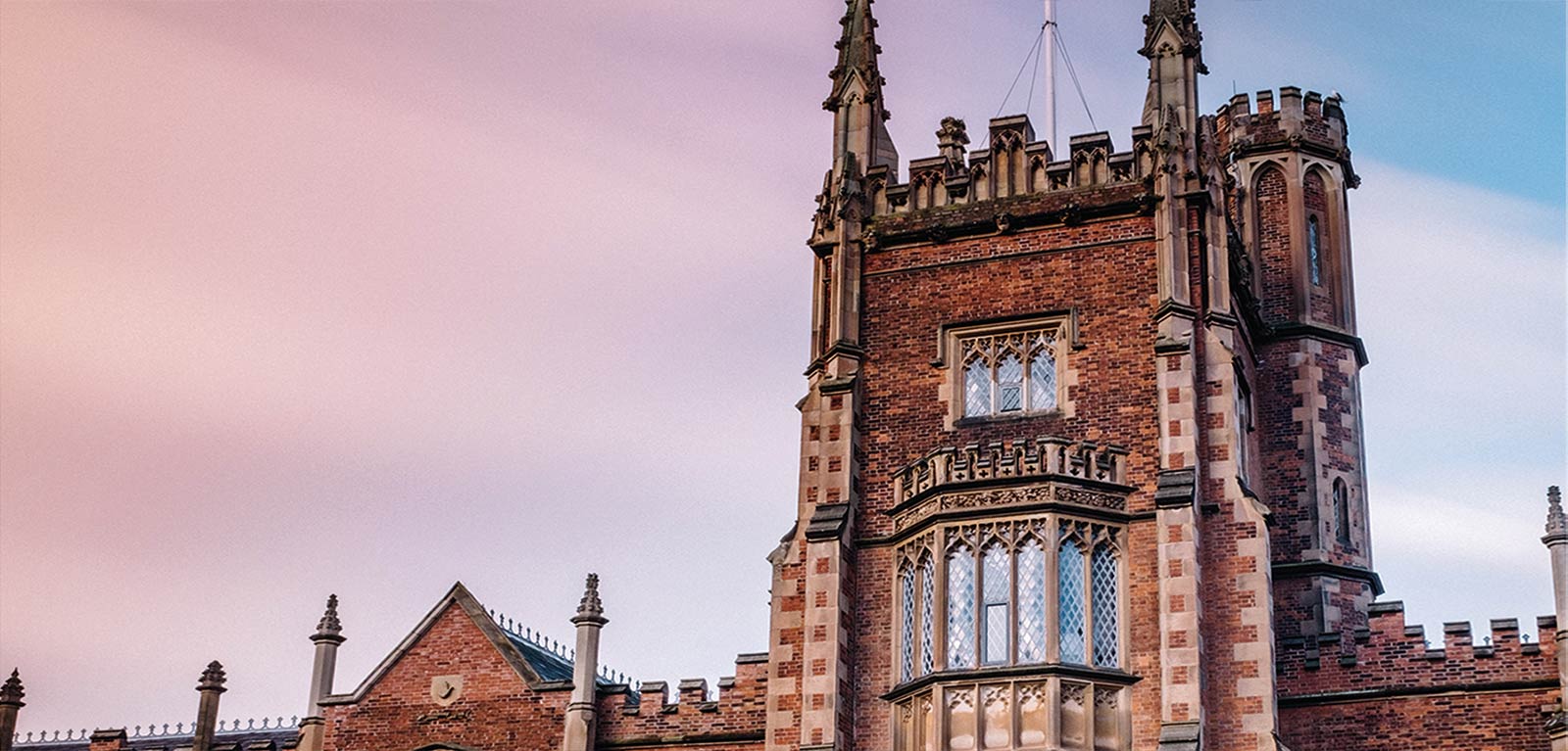 top of the Lanyon building with a blue and pink coloured sky