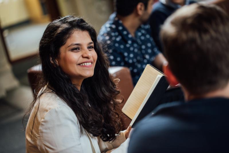 Female student smiling to a male classmate 