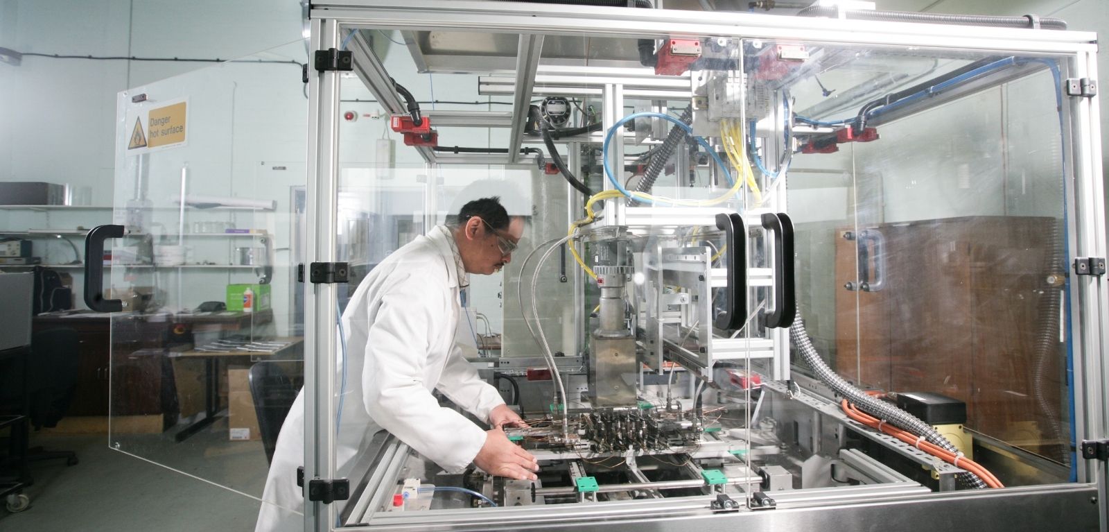 A person using a thermoforming machine.