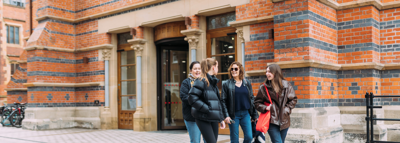 Students walking out of Grad School