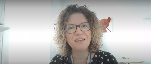 Woman with glasses and curly hair