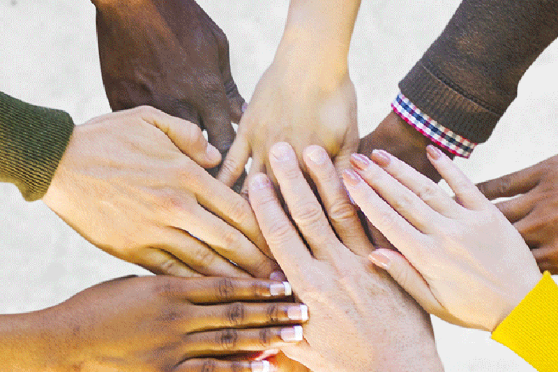 a group of hands in a circle