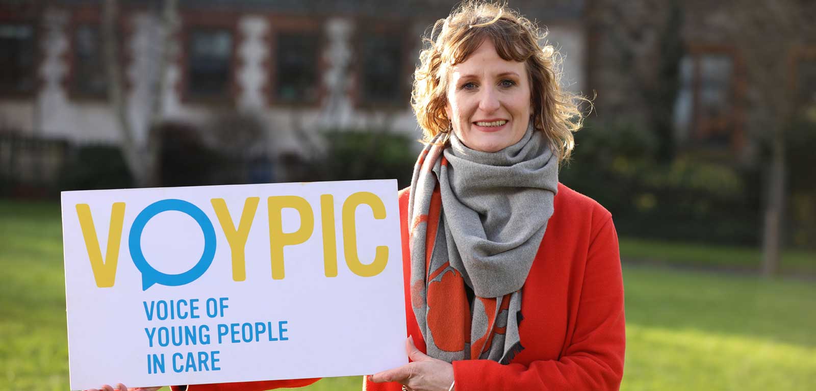 Alicia Toal holding a VOYPIC banner