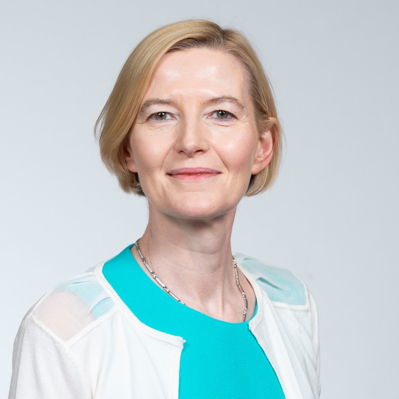 Head and shoulders of Isabel Torres wearing a turquoise blouse and white cardigan