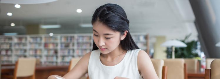 Chinese student reading a book