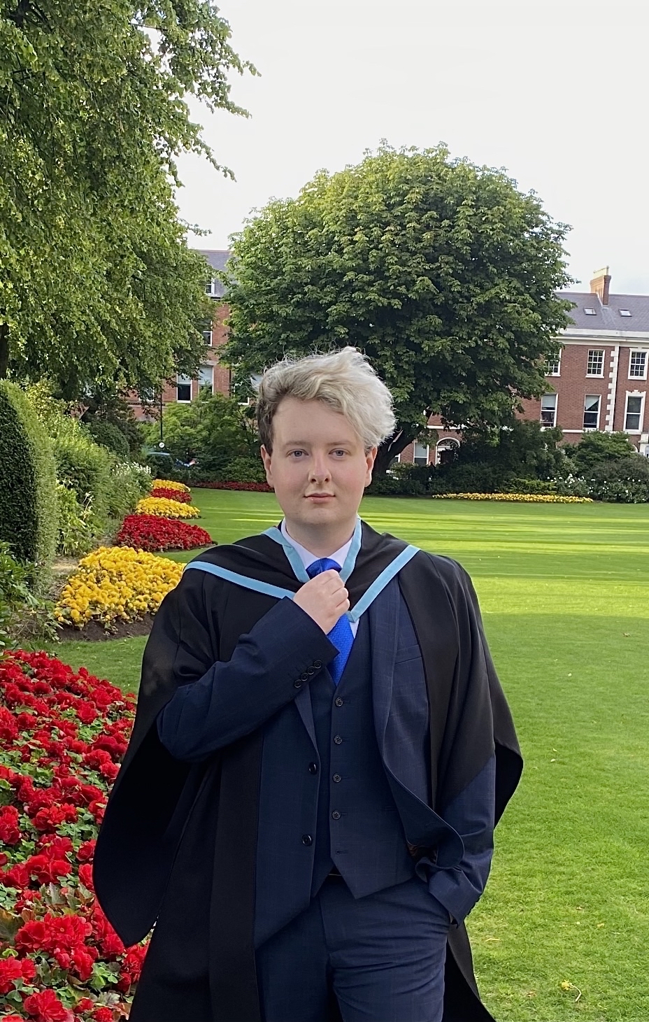 Male student on graduation day outside the university