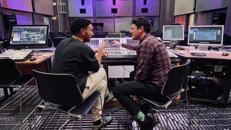 Two men at a sound mixing desk