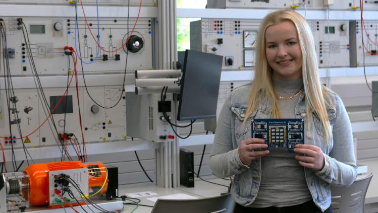 Female Student Ashby Building holding Grove Electronics Kit