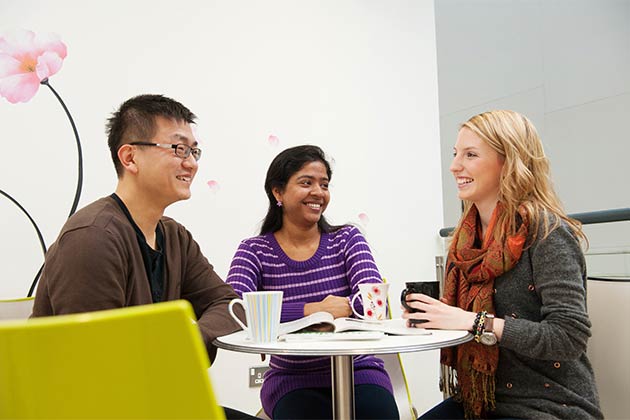 3 students relaxing and drinking coffee