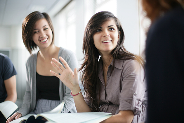 international students discussing lecture notes