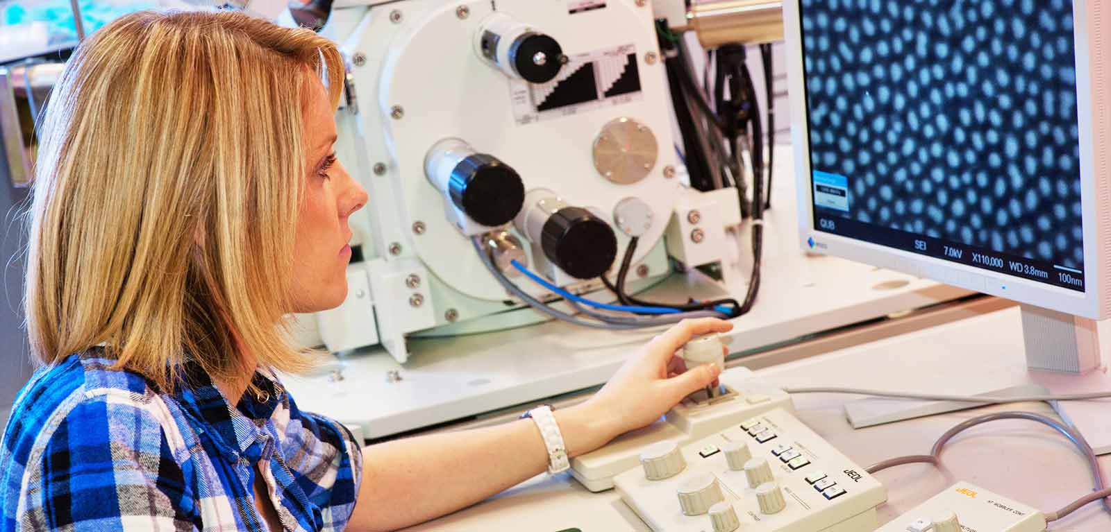 Girl sitting at a computer manipulating imagery