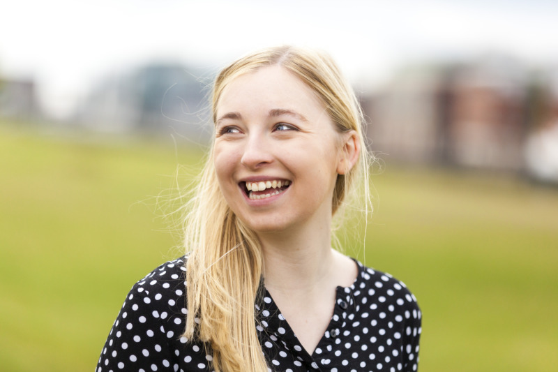 smiling female student looking away from camera