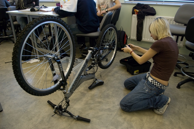 Student working with a bicycle