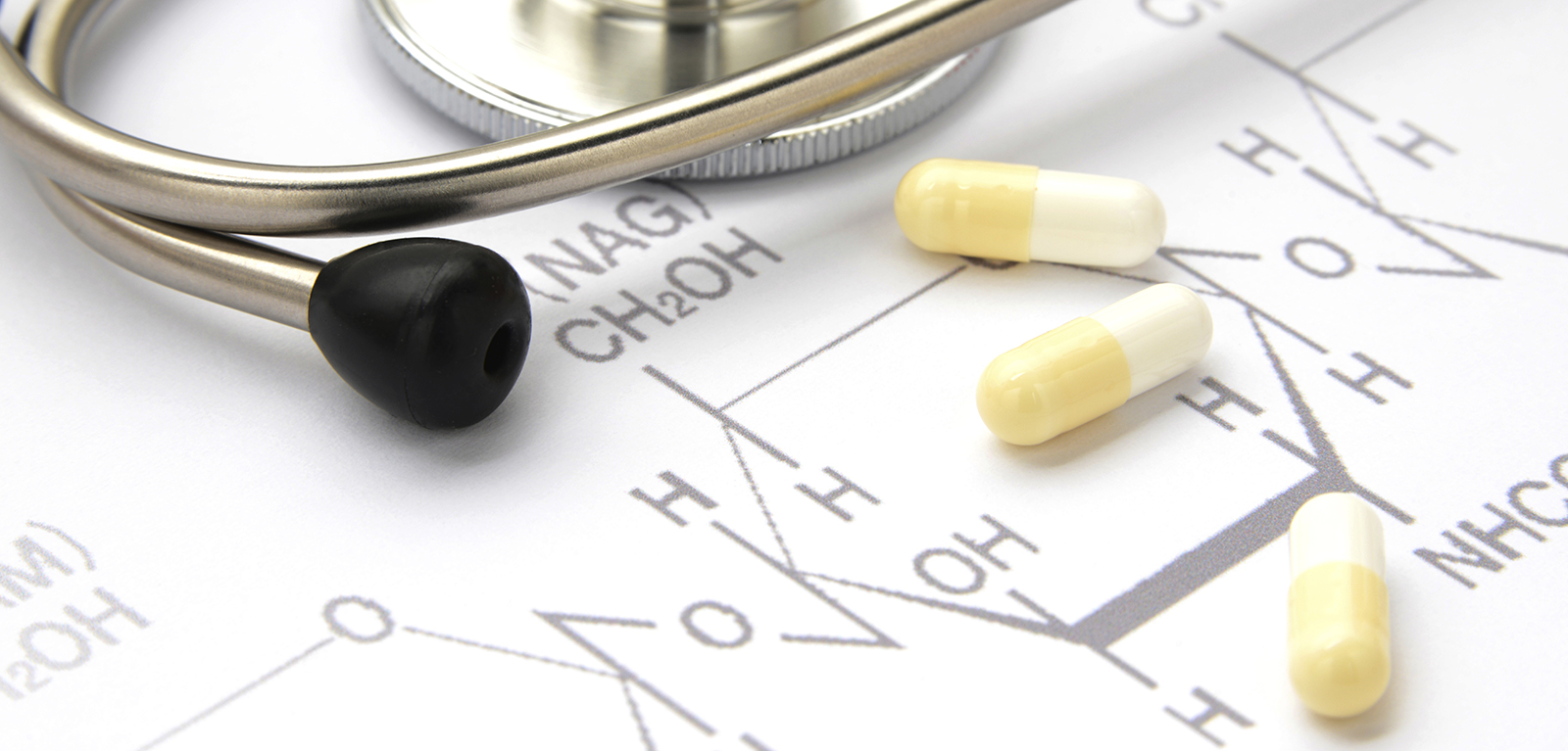 Image of molecular structures, capsules and a stethoscope