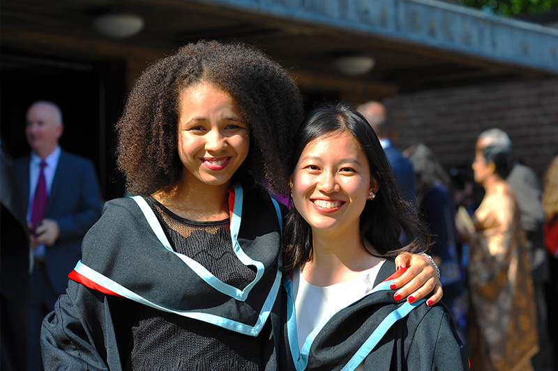 2 international female students celebrating graduation