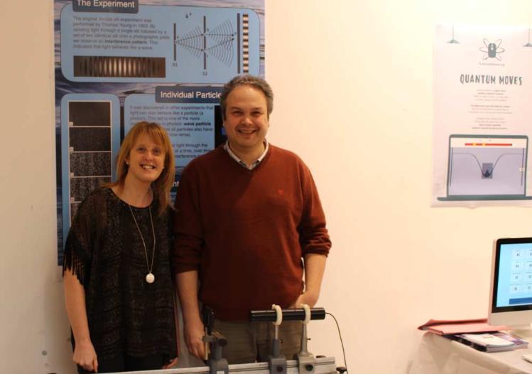 Ramsbottom and Ballance posing in front of a scientific poster
