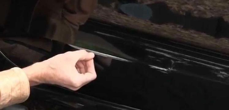 A scratch in a car's paint