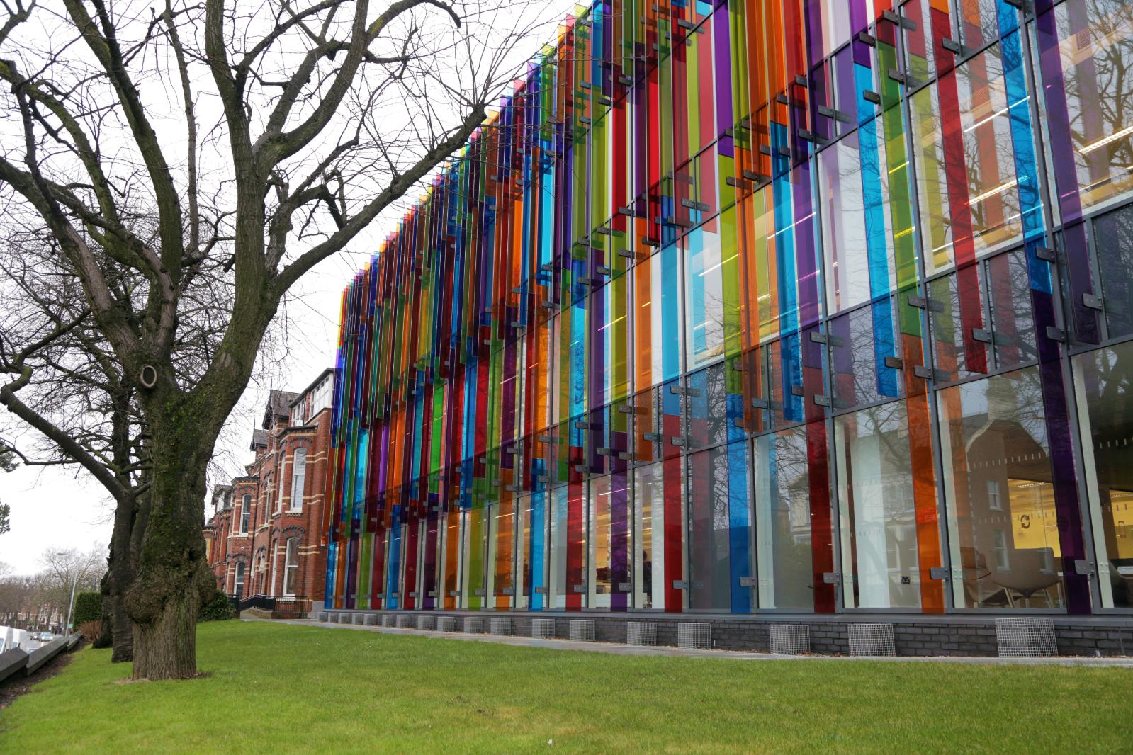 The colourful glass on the front of the QUB Computer Science Building