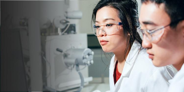 male and female working in a lab