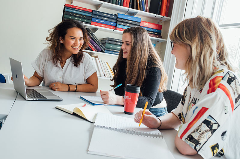 Close up of students doing group work in HAPP