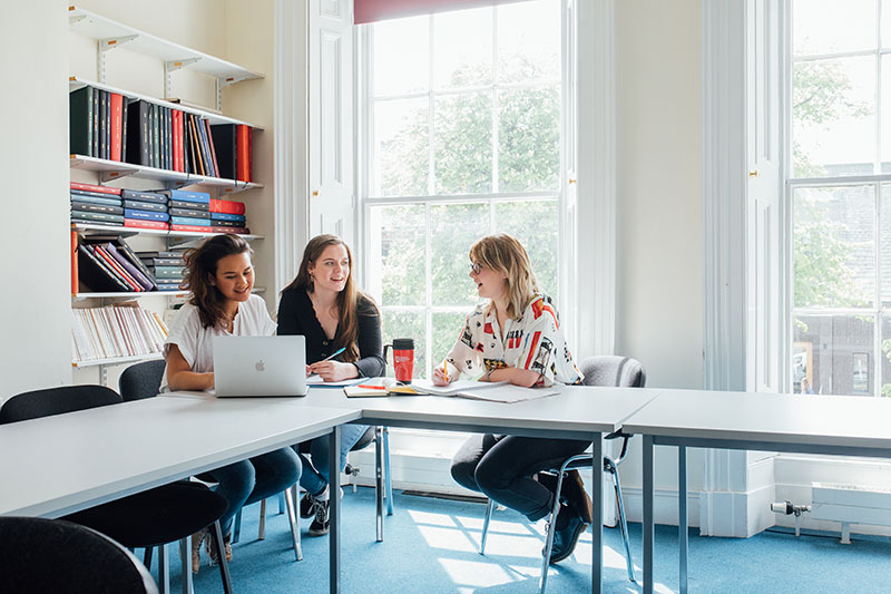 Students doing group work in HAPP room